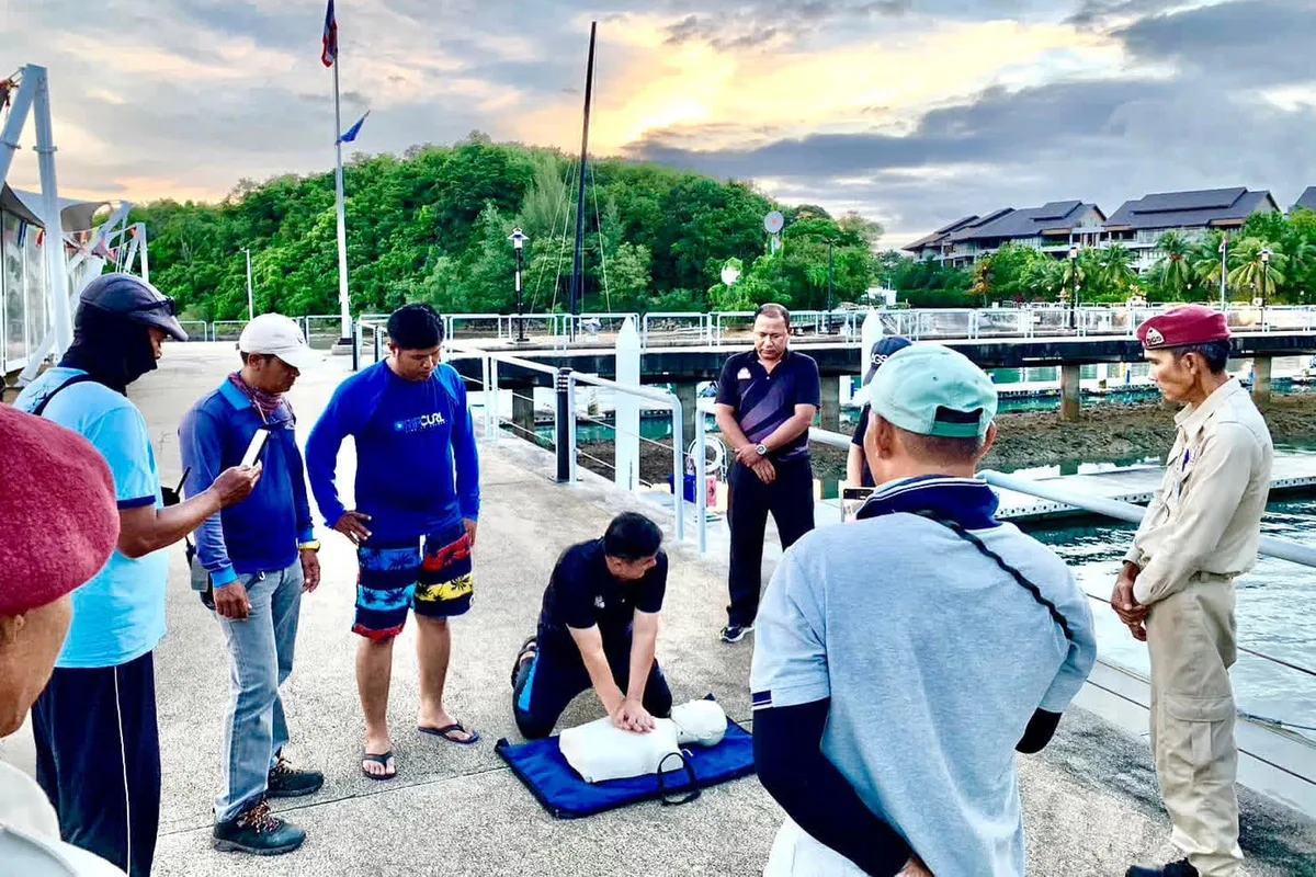 Wider view of SGS dockside CPR training at sunset