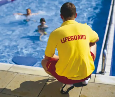 SGS-trained lifeguard watching swimmers on a patrolled Phuket beach